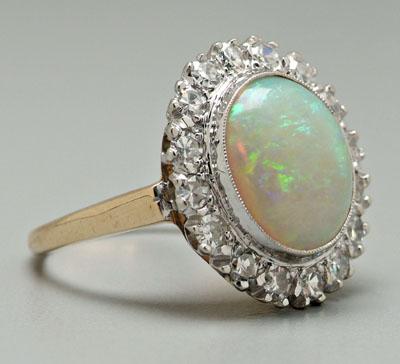 Appraisal: White opal and diamond ring oval cabochon white opal estimated