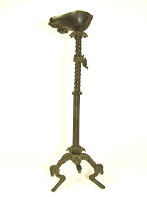 Appraisal: A Neapolitan bronze oil torchere after the antique the twist