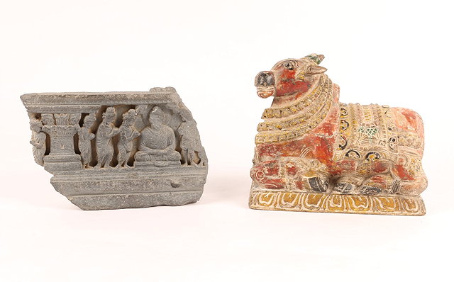 Appraisal: AN INDIAN PAINTED WOODEN NANDI BULL on a rectangular plinth