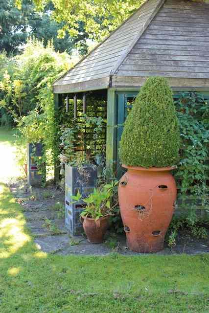 Appraisal: A LARGE PAIR OF WHICHFORD POTTERY TERRACOTTA STRAWBERRY PLANTERS high