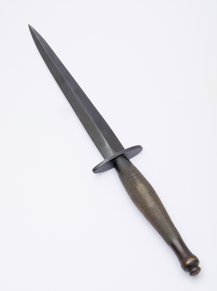 Appraisal: CONTINENTAL BRONZE AND METAL DAGGER-FORM LETTER OPENER With an engine-turned