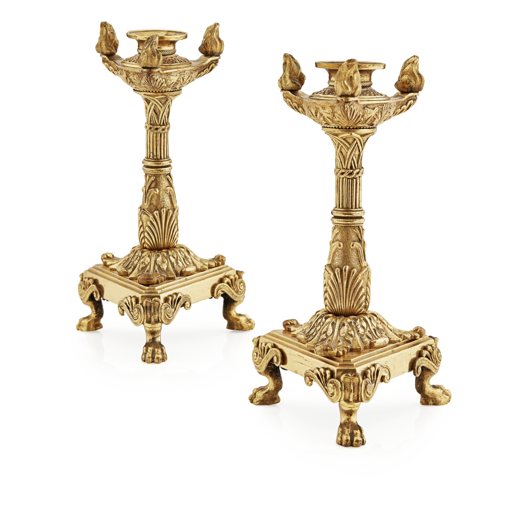 Appraisal: PAIR OF FRENCH EMPIRE GILT BRONZE CANDLESTICKS TH CENTURY the