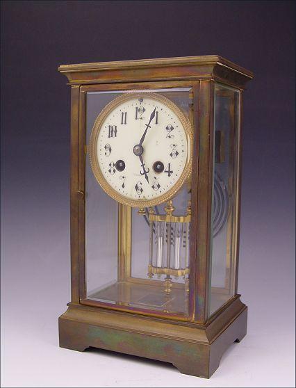 Appraisal: FRENCH CRYSTAL REGULATOR CLOCK Brass case with beveled glass on