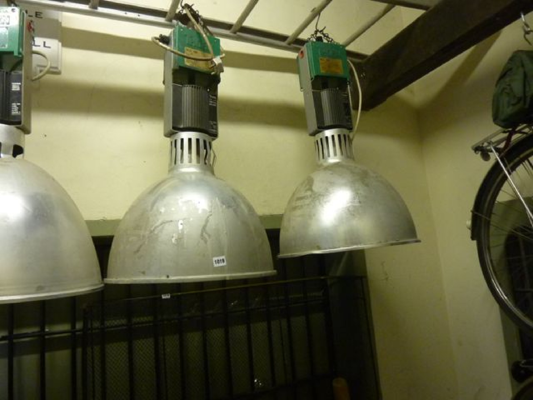 Appraisal: A pair of industrial ceiling lights by Thorn to take