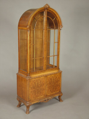 Appraisal: A walnut display cabinet mid th century the domed bead