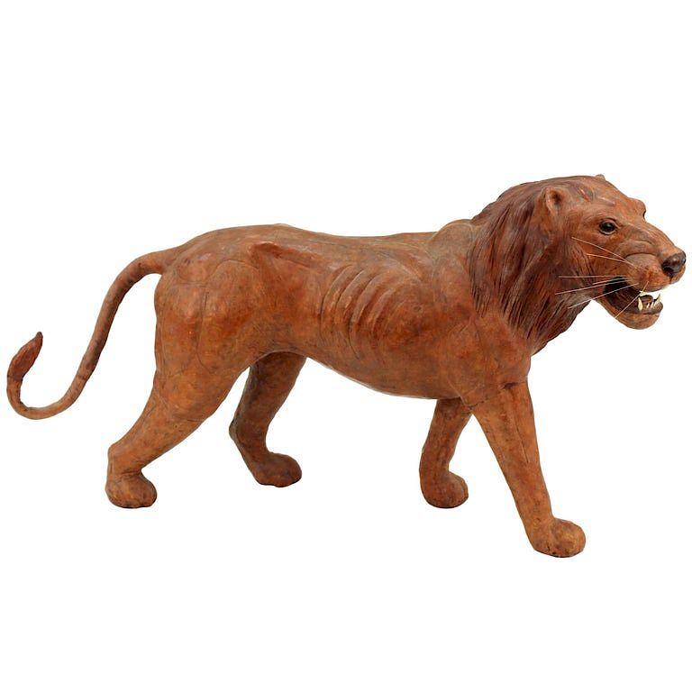 Appraisal: Leather Lion Sculpture Leather lion sculpture w pronounced teeth and