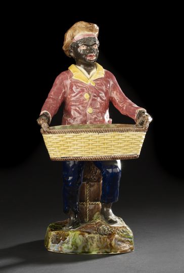 Appraisal: Large English Polychromed Majolica Figure of a Standing Young Blackamoor