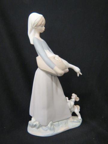 Appraisal: Lladro Porcelain Figurine of Girl with Goose puppy at her