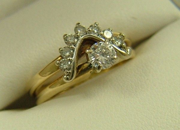 Appraisal: DIAMOND WEDDING RING SET K yellow gold settings estimated weight