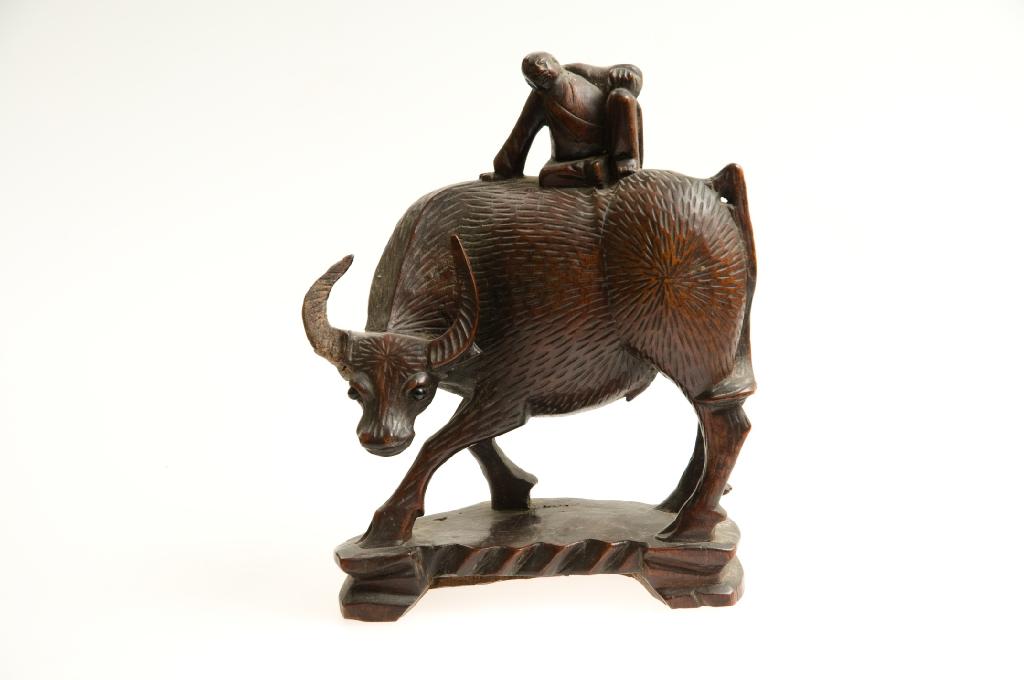 Appraisal: CHINESE CARVED MODEL OF A BUFFALO AND PEASANT c restoration