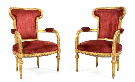 Appraisal: A Pair of Louis XVI Style Giltwood Fauteuils having upholstered