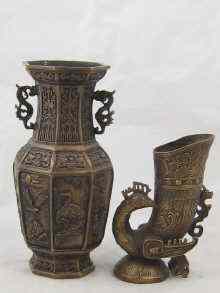 Appraisal: A Chinese bronze vase of octagonal shape the cast panels