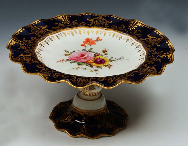 Appraisal: A ROYAL CROWN DERBY TAZZA painted with flower spray in