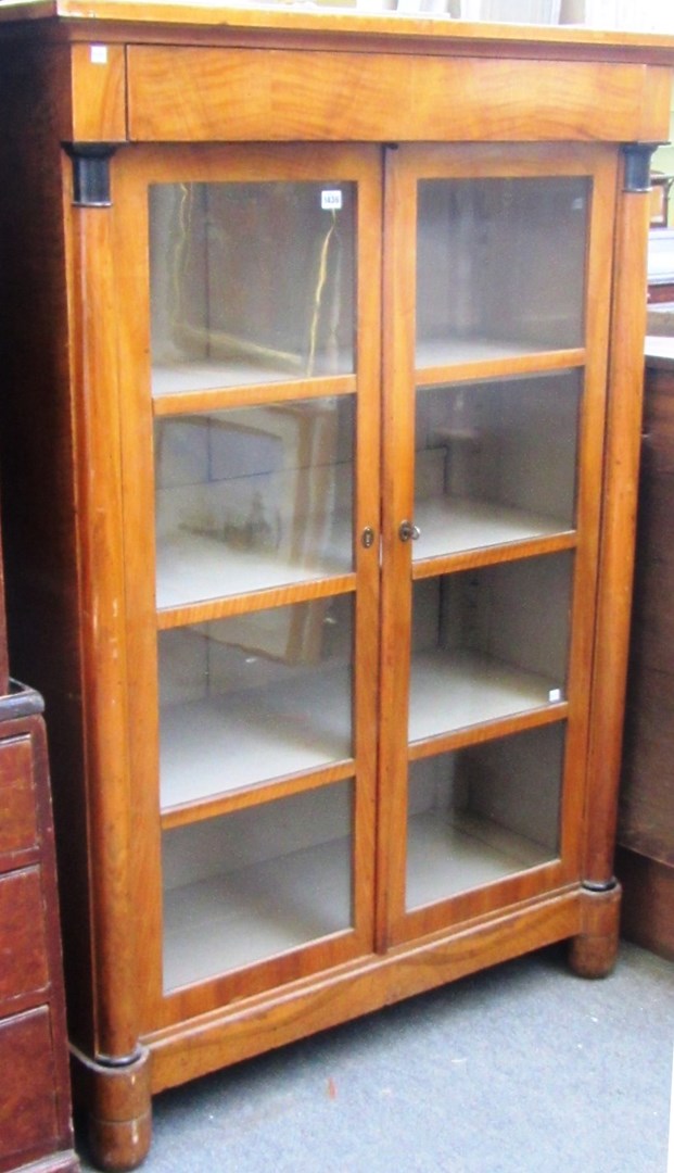 Appraisal: An early th French walnut glazed two door cupboard with