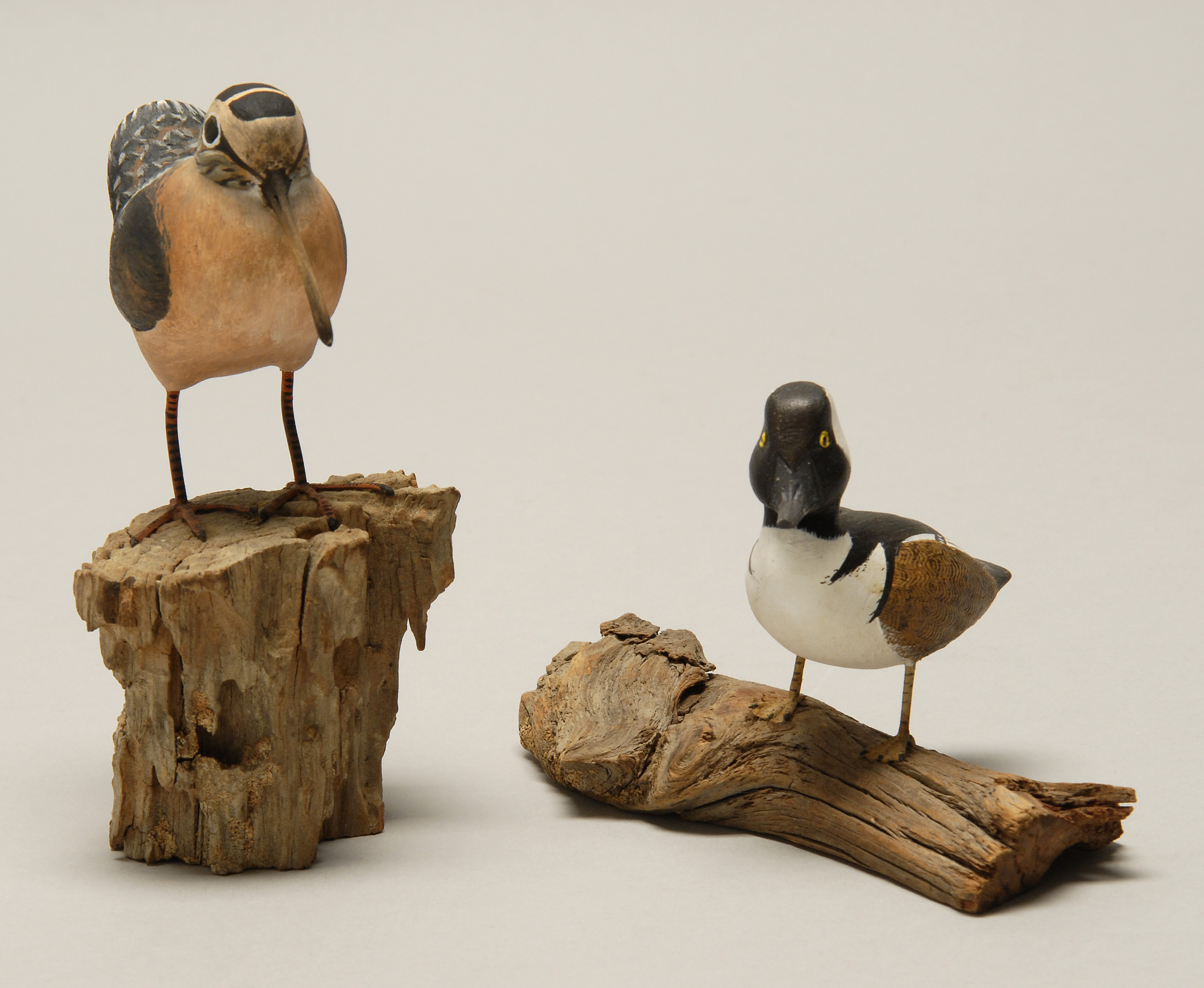 Appraisal: TWO MINIATURE BIRD CARVINGS A woodcock by A F Clark