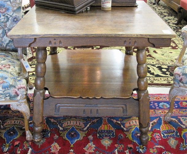 Appraisal: LARGE TWO-TIER OAK LAMP TABLE American early th century having