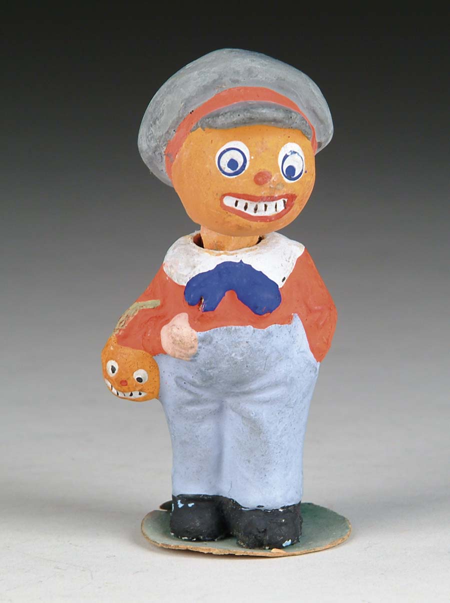 Appraisal: TRICK-OR-TREATER CANDY CONTAINER Colorful composition pumpkin-head figure carries miniature jack-o-lantern