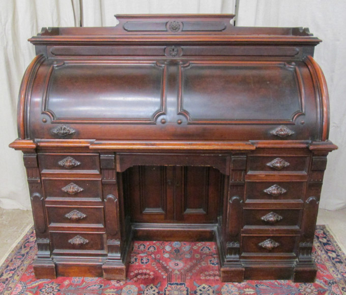 Appraisal: A VICTORIAN WALNUT CYLINDER-ROLL DESK American third quarter of the