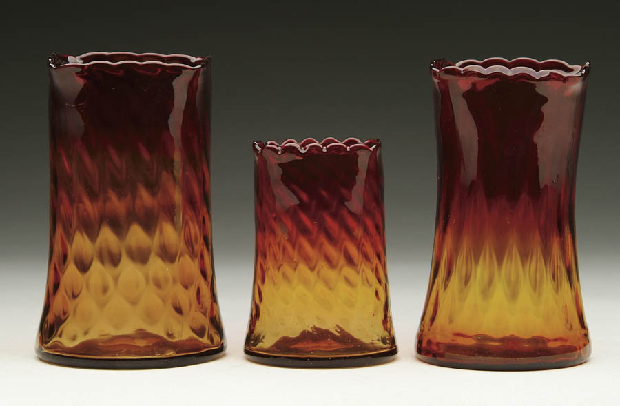 Appraisal: THREE AMBERINA VASES Three Amberina vases of similar design varying