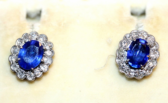 Appraisal: A PAIR OF SAPPHIRE AND DIAMOND SET EAR STUDS oval