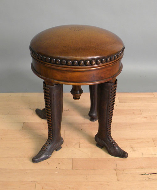 Appraisal: Leather top revolving stool with iron boot form legs h