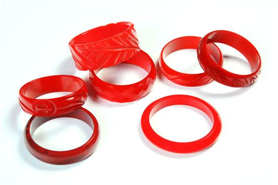 Appraisal: SEVEN EARLY PLASTIC RED BANGLE BRACELETS American Ca - Most