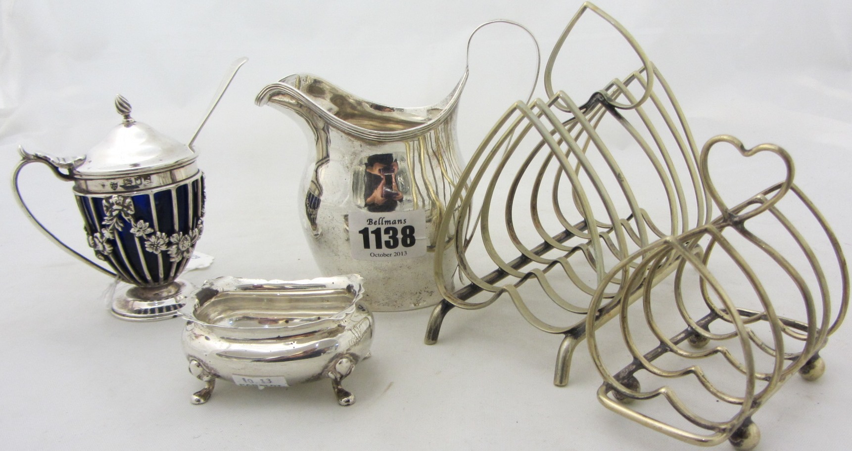 Appraisal: Silver comprising a helmet shaped milk jug probably Birmingham a