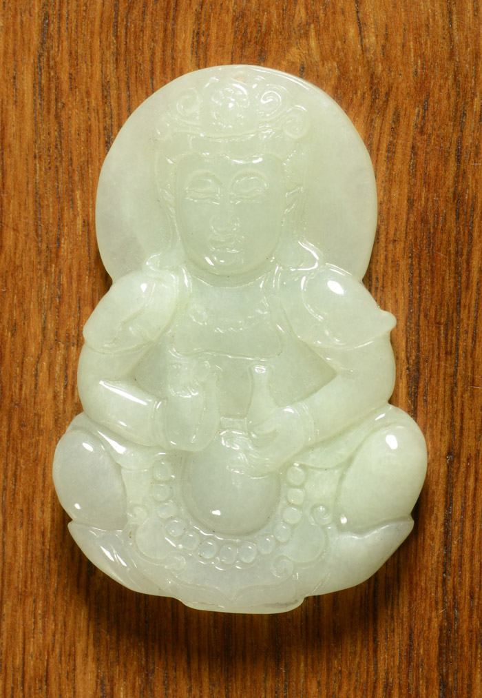 Appraisal: CHINESE CARVED JADE PENDANT light green jade carving of Kwan