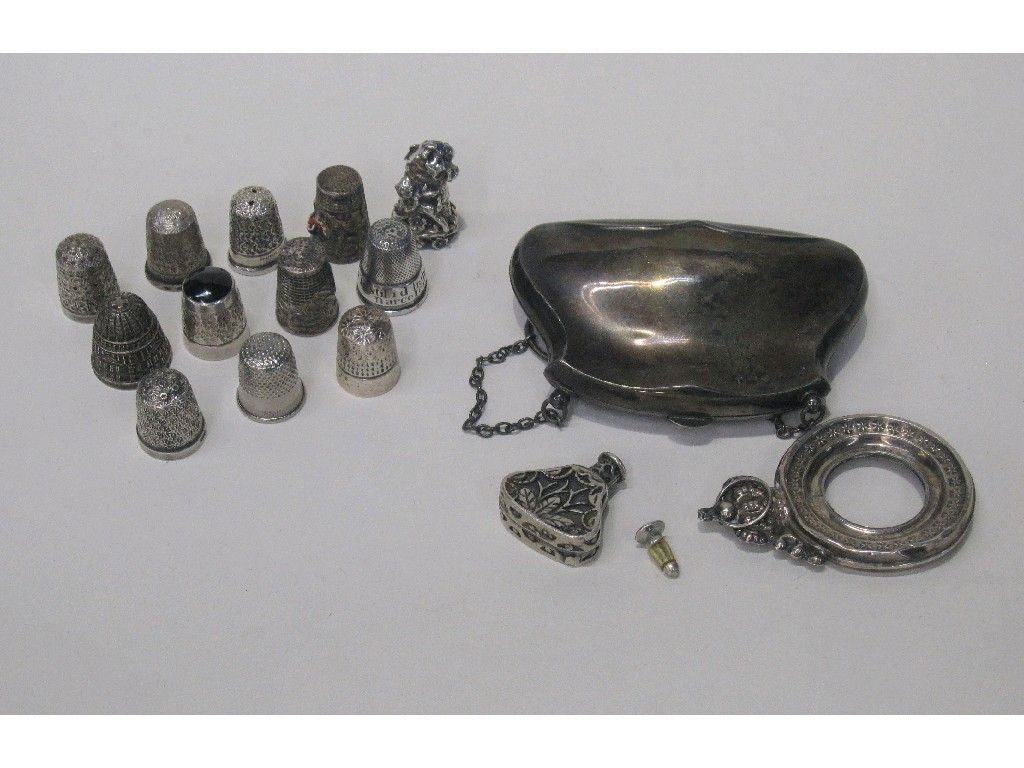 Appraisal: Lot comprising silver purse twelve thimbles a scent bottle and