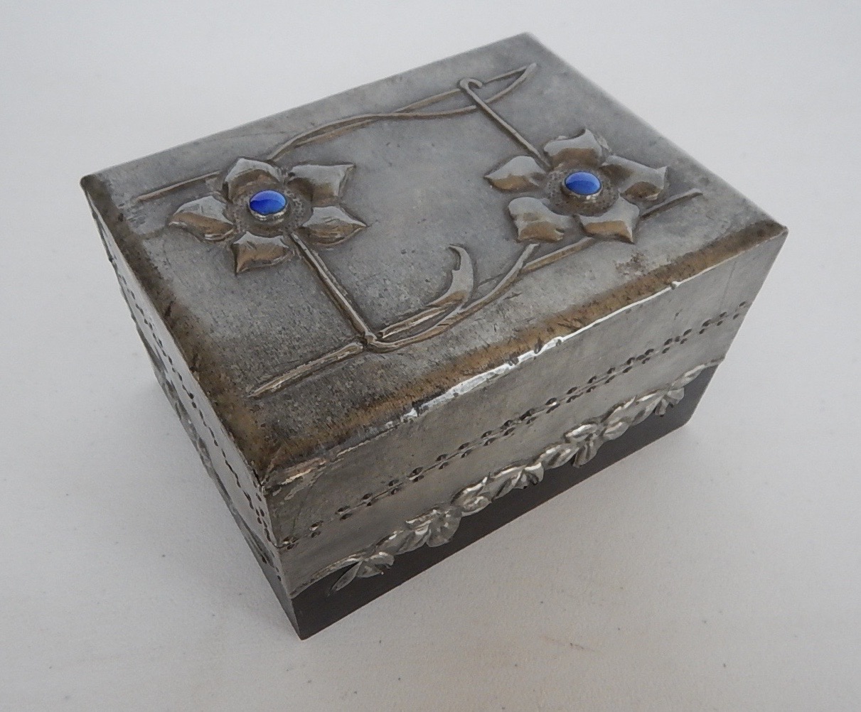 Appraisal: An Art Nouveau box with hinged lid decorated with embossed