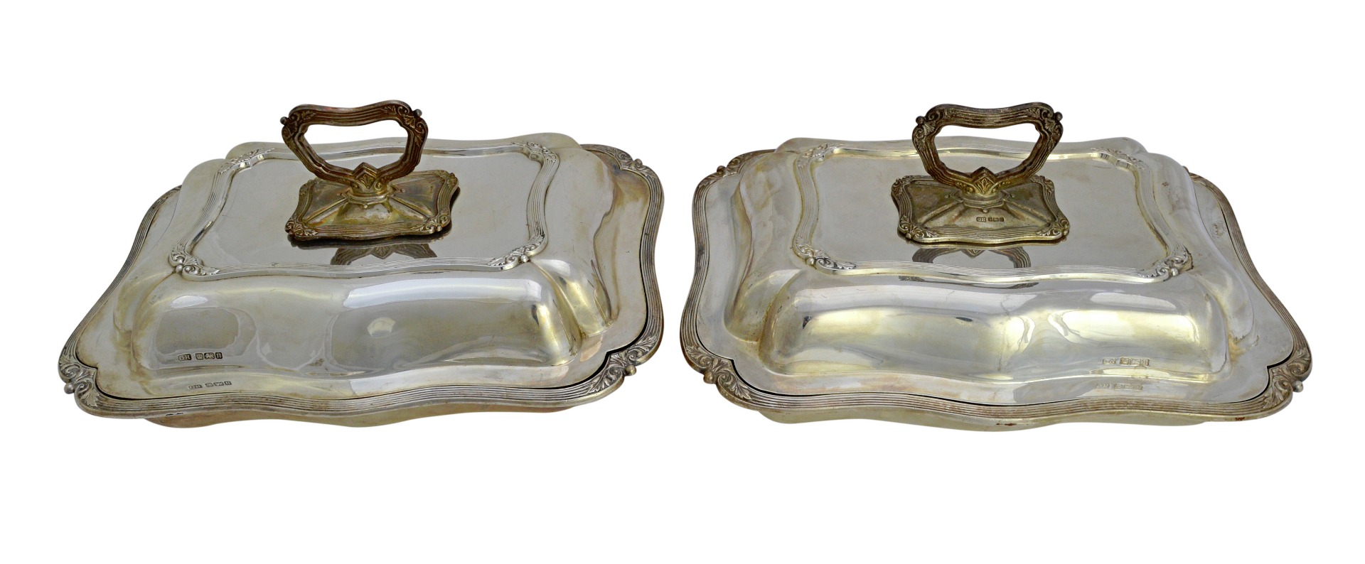 Appraisal: A pair of silver shaped rectangular lidded entree dishes each