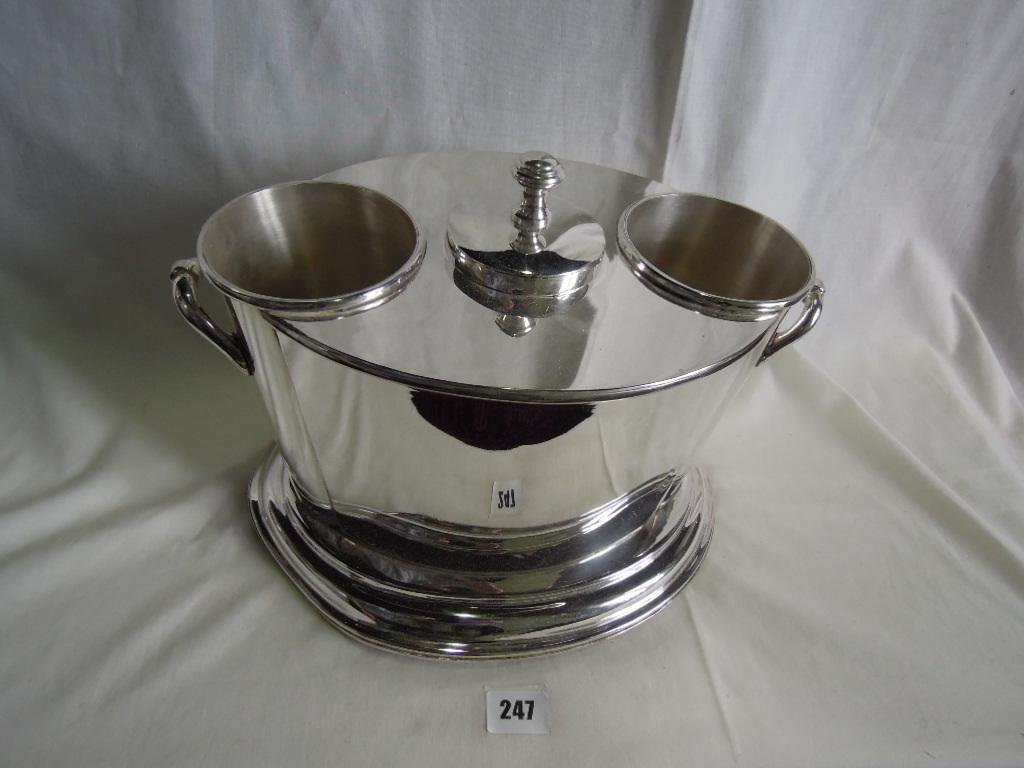 Appraisal: A silver plated two bottle wine cooler of oval form