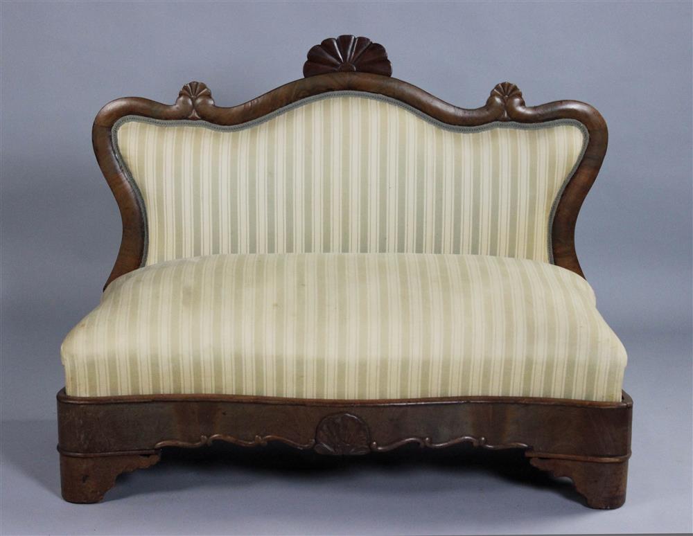 Appraisal: DIMINUTIVE EMPIRE HARDWOOD SETTEE WITH STRIPED UPHOLSTERY having a shaped