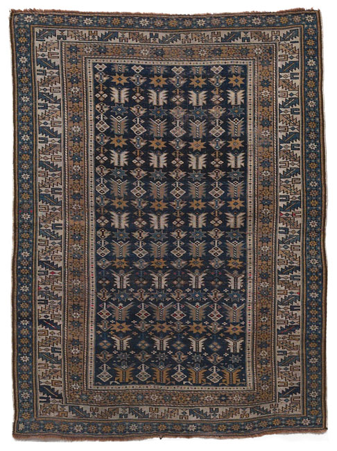 Appraisal: Caucasian rug c stylized floral design in olive green and