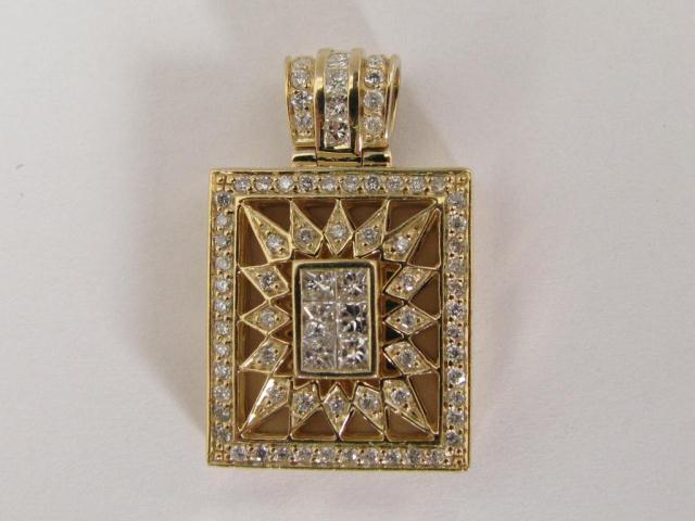 Appraisal: Stunning k yellow gold and diamond pendant with six invisible