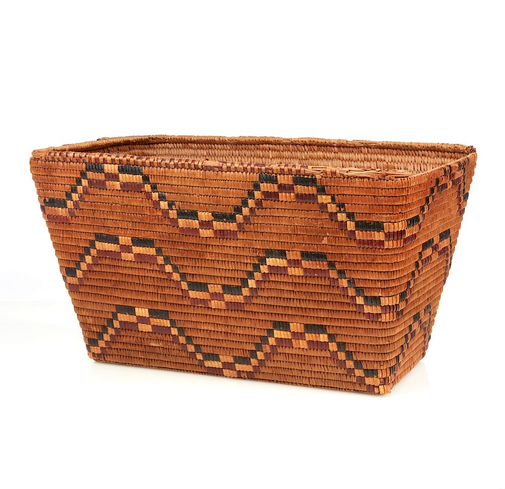 Appraisal: Northwest Basket Large Northwest rectangular basket with geometric polychrome decoration