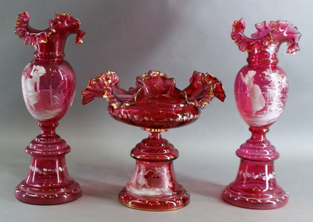 Appraisal: A Mary Gregory tazza in cranberry glass painted with a