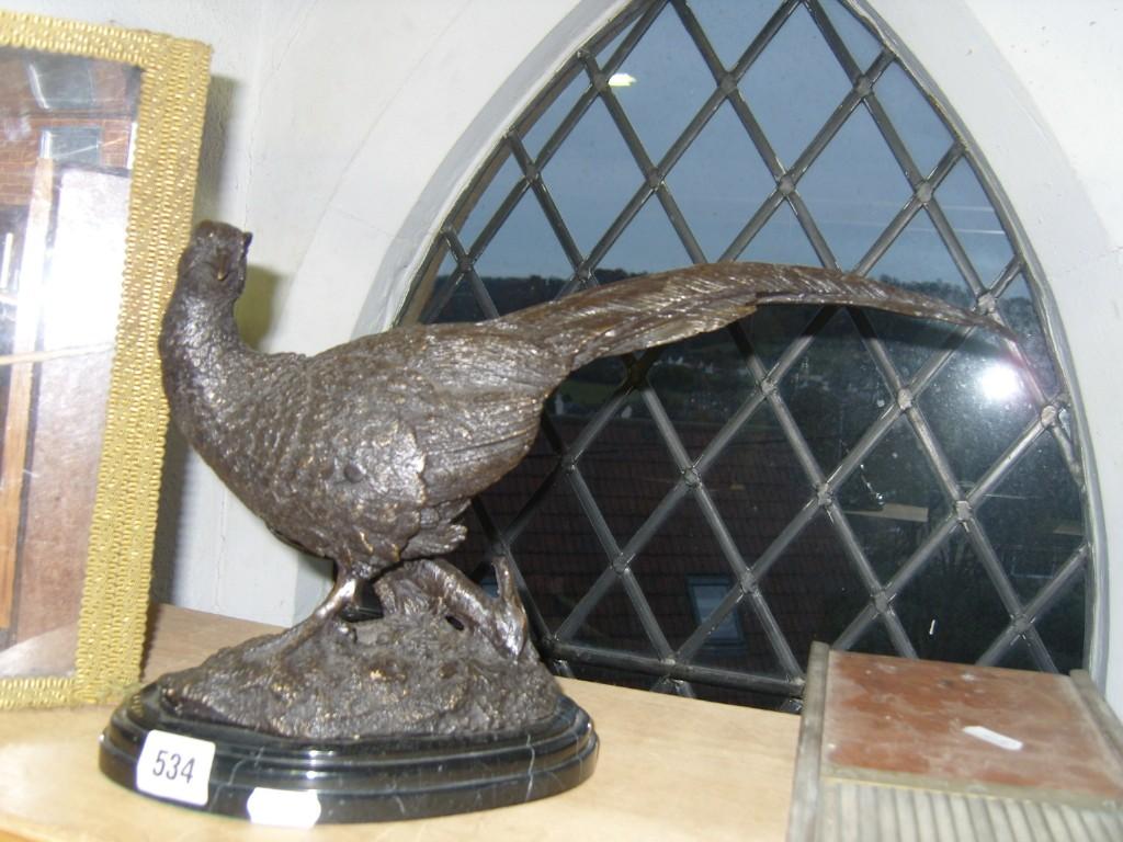 Appraisal: A cast bronze model of a pheasant with signature to