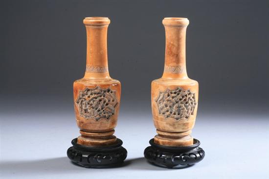 Appraisal: PAIR CHINESE IVORY VASES Carved to depict figures under pine