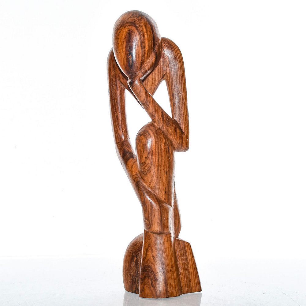 Appraisal: WEST AFRICAN WOODEN SCULPTURE THE THINKER Carved abstract art model