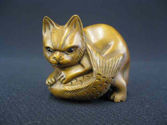 Appraisal: Carved Boxwood Netsuke of a Cat with fish signed ''