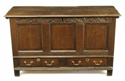 Appraisal: A joined oak mule chest the moulded edge hinged top