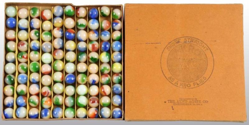 Appraisal: Original Box of Akro Agate Tri-Colored Marbles Description Includes tri-color