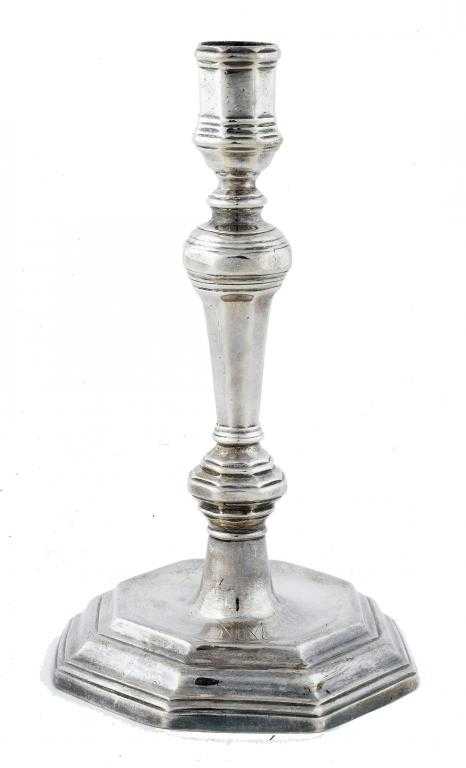 Appraisal: A FRENCH LOUIS XV PROVINCIAL CANDLESTICK with moulded octagonal sconce