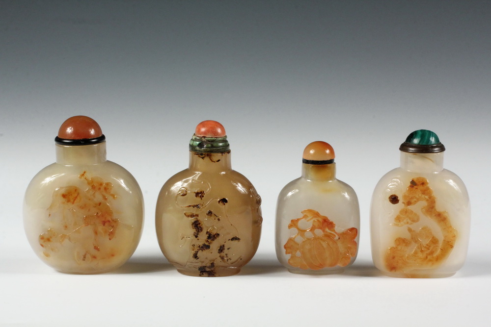 Appraisal: A GROUP OF CARVED AGATE SNUFF BOTTLES - Including A