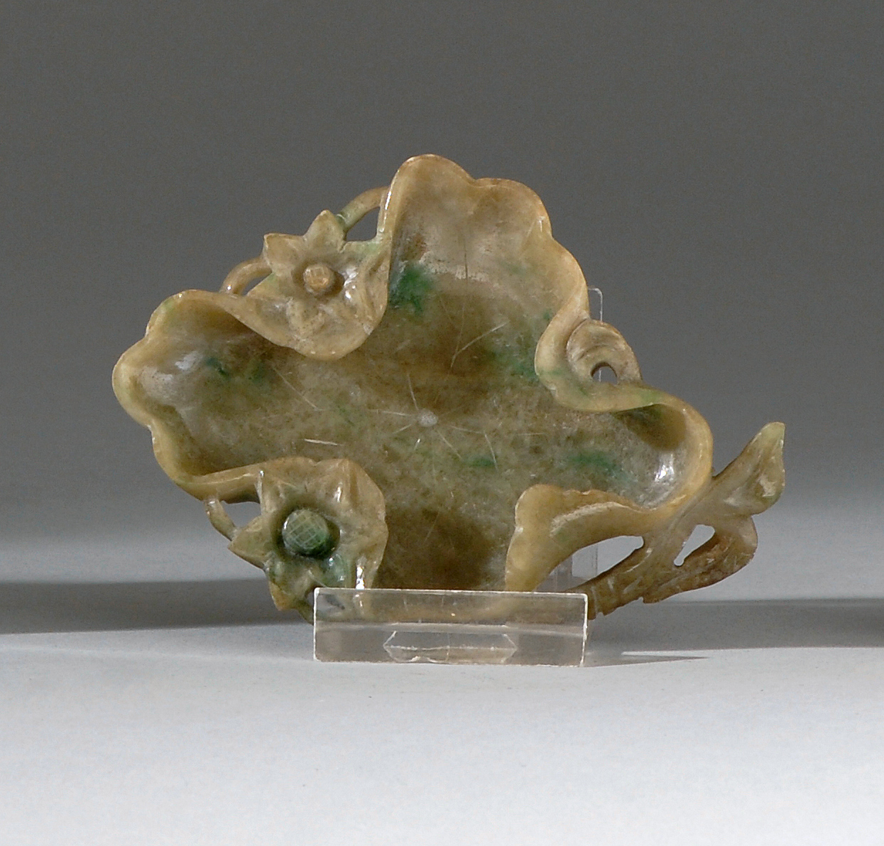 Appraisal: SPOTTED GREEN JADEITE WRITER'S COUPE th CenturyIn lotus leaf form