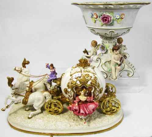 Appraisal: Porcelain centrepiece Vase floral with cupids and a figure Cinderellas