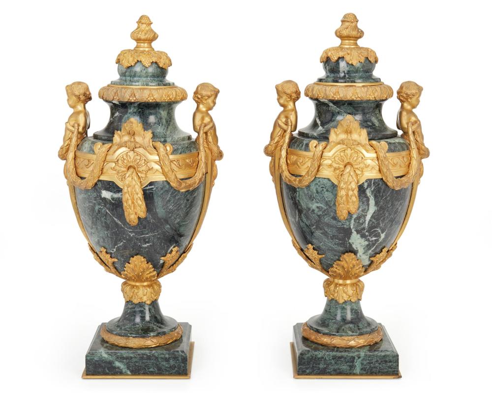 Appraisal: A pair of French Louis XVI-style gilt-bronze and marble urns