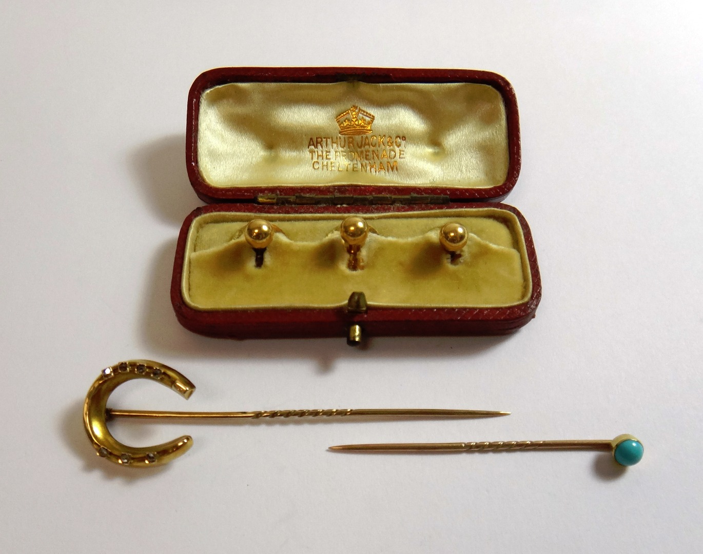 Appraisal: A gold and diamond set stick pin the finial designed