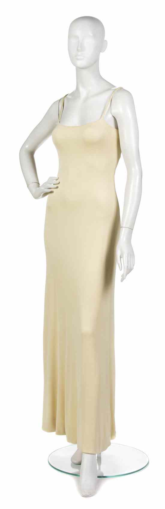 Appraisal: A Halston Pale Yellow Jersey Evening Gown spaghetti straps Labeled